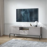 Szafka RTV Nuo szara z ryflowanymi drzwiczkami i szufladą 