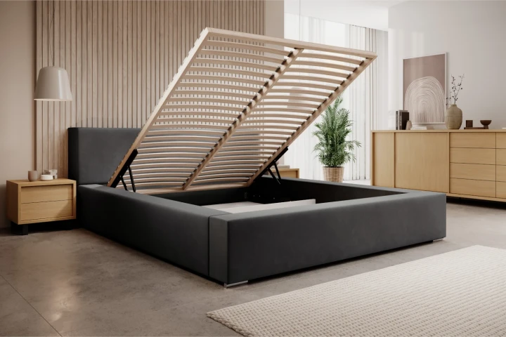 Łóżko tapicerowane z pojemnikiem na pościel i stelażem Calvero Grafit